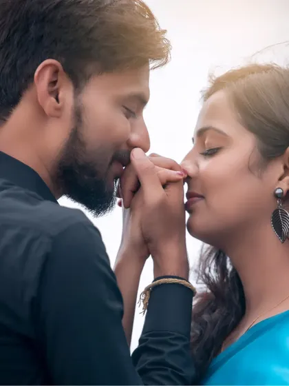 A tender close-up from a pre-wedding shoot. This intimate moment captures the gentle affection between the couple, highlighting the small gestures of love.