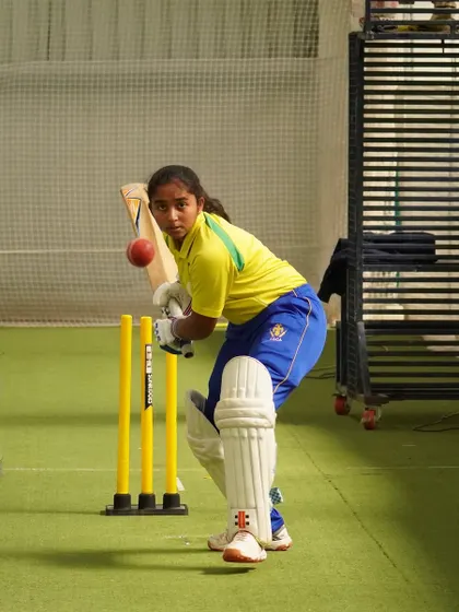 Eyes on the ball. A young Mithila Vinod during a practice session, demonstrating the focus that made her a star.