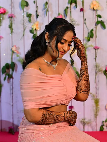 A graceful pose from Shilpa, showing how the mehendi complements her elegant look.