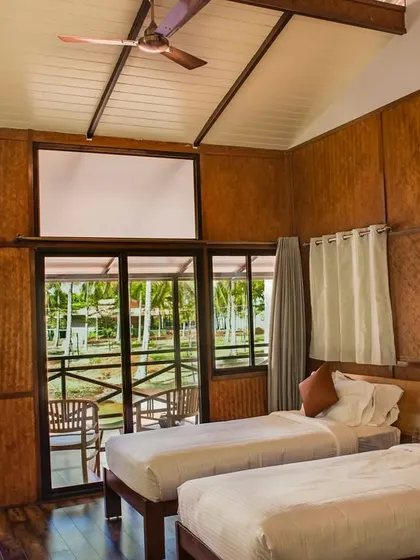 Our villament rooms at Kabini offer a private and luxurious stay, with beautiful views from the large windows.