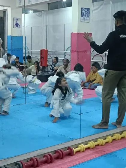 Instructors demonstrating an exercise to the class.