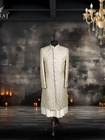This majestic light gold sherwani is crafted from luxurious silk and adorned with multicolour intricate details. Paired with a silk kurta, it embodies the grandeur and opulence of Persian royalty.