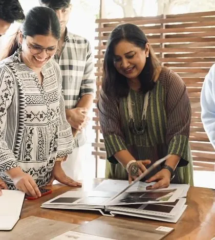 Gayathri Shetty reviewing material samples with the team.