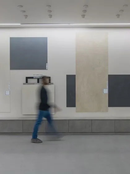 More images from the Krsimar marble showroom, detailing the sliding panel display system and the clean, spacious layout designed for an optimal client experience.