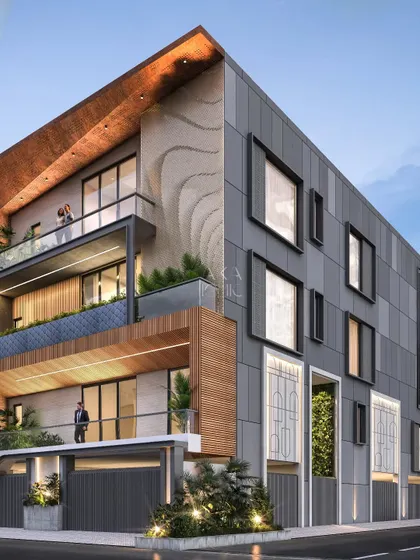 This residential project features a facade with offset window frames, creating a playful, unconventional pattern on the gray paneled wall. This is contrasted with a section of wood cladding and open balconies.