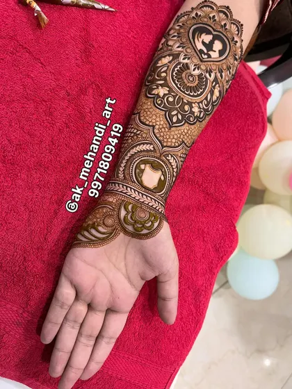 A full-arm view of the baby shower design, incorporating the special motif into a larger, flowing pattern.