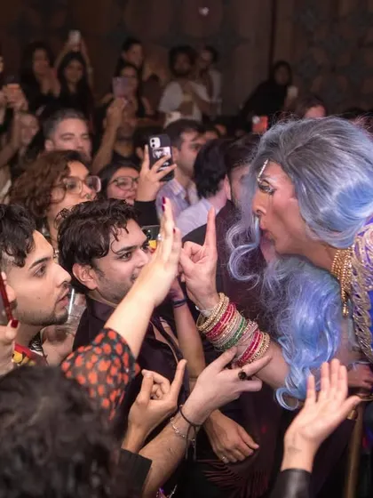 A drag performer interacting with the audience. These moments create a special connection and make the night memorable for everyone.