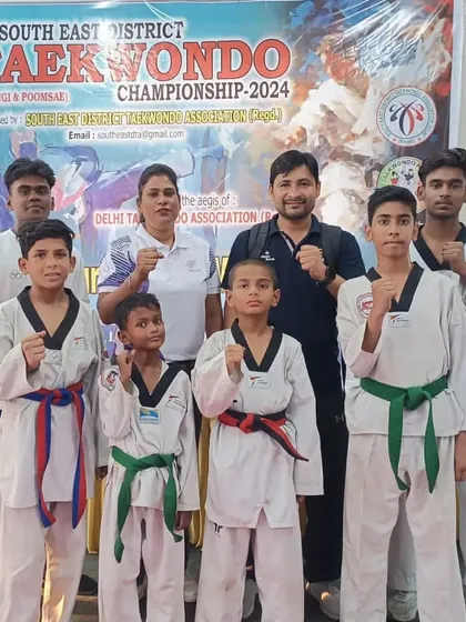 Our team at the 11th South East District Taekwondo Championship. We stand together as a team, supporting each other.
