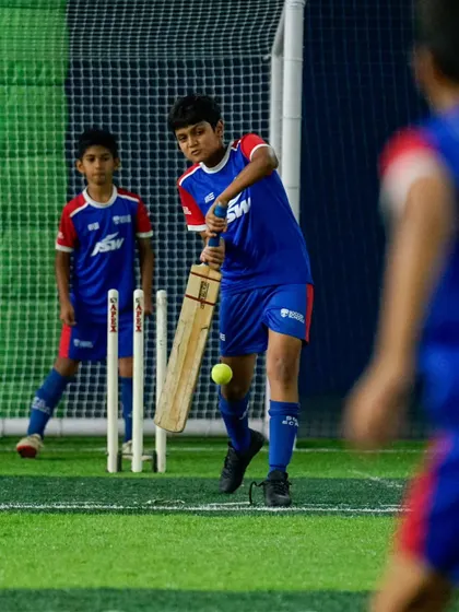 How's that for a shot? A young footballer swaps his boots for a bat and pads during our multi-sport celebration on National Sports Day.