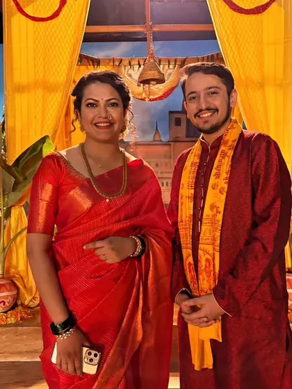 Posing with another talented co-artist on the beautifully crafted set. Being part of such a professional production was a great learning experience.