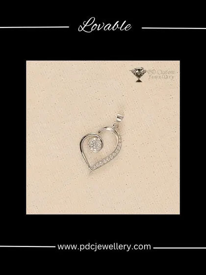 A lovable heart-shaped pendant crafted in white gold and diamonds. The design features a swirling line of diamonds leading to a central solitaire, creating a modern and romantic look.
