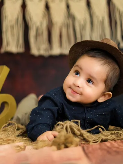 A curious little explorer at his half-birthday shoot. His sweet, upward glance is absolutely heart-melting.