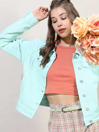 A soft, pastel look I styled featuring a mint green denim jacket over a crop top and plaid skirt, perfect for a spring-summer collection.