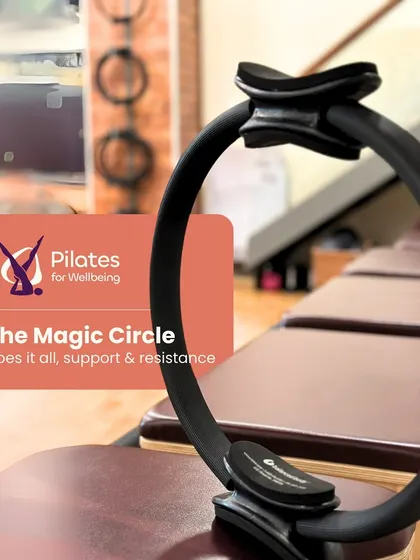 The Magic Circle, seen here resting on a Reformer, does it all. It provides both support and resistance, making it a versatile prop for deepening your engagement and challenging your stability.