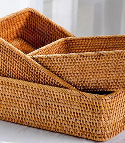 This set of three nesting rectangular baskets offers a versatile storage solution. The detailed weaving and sturdy construction make them ideal for organizing office supplies, bathroom toiletries, or kitchen essentials.