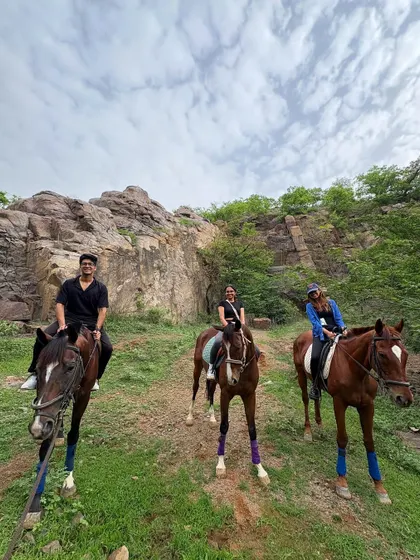 A group of friends enjoying their ride together against the backdrop of the rocky Aravali terrain. Our safaris are a great way to bond and share a unique outdoor adventure.