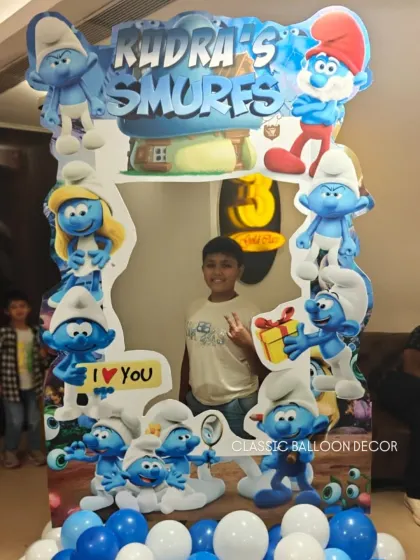 A fun Smurfs themed photo booth frame, perfect for guests to take memorable pictures at the party.