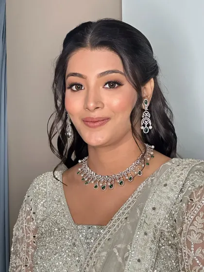 A portrait of my lovely bride. The makeup is soft and enhances her natural features, while the half-up hairstyle adds a touch of modern romance.