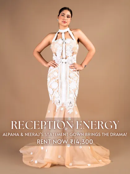 Bring the drama with 'Reception Energy' in this statement gown by Alpana & Neeraj. The white floral appliqué on a nude base with a halter neck and fishtail cut ensures you will make a memorable entrance.
