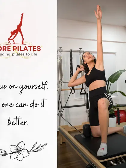 Focus on yourself. This client demonstrates a graceful side stretch on the Reformer, a perfect example of the strength and poise developed through Pilates.