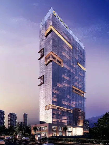 A render of the Kohinoor Ikon commercial tower at dusk.