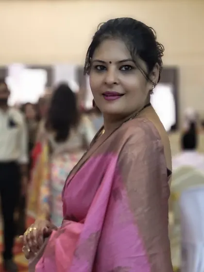 A pure silk saree in a beautiful shade of pink, styled for a wedding reception. I paired it with a sleeveless blouse and minimal jewelry to let the fabric shine.