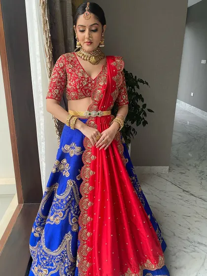 Another angle of the vibrant half-saree, showing the beautiful embroidery and the elegant way it's draped.