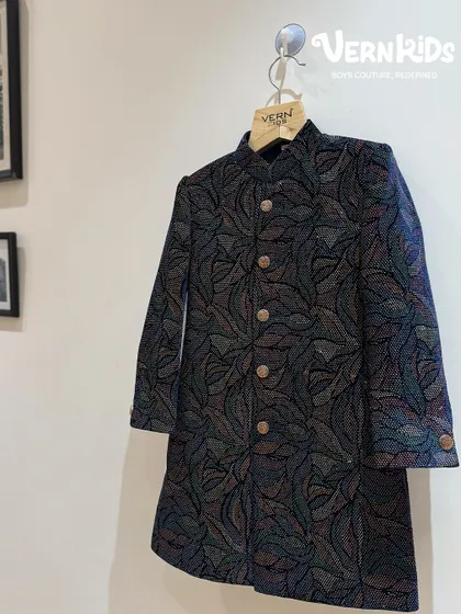 A closer look at our multi-hued Jodhpuri jacket. The intricate, colorful pattern adds a touch of modern artistry to a traditional silhouette, making it a standout piece for any festive event.