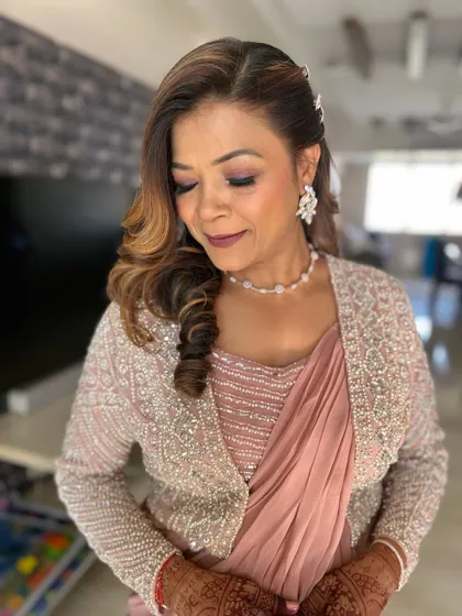 A beautiful makeover for the mother of the bride. The makeup is elegant and timeless, with a focus on glowing skin and softly defined eyes.