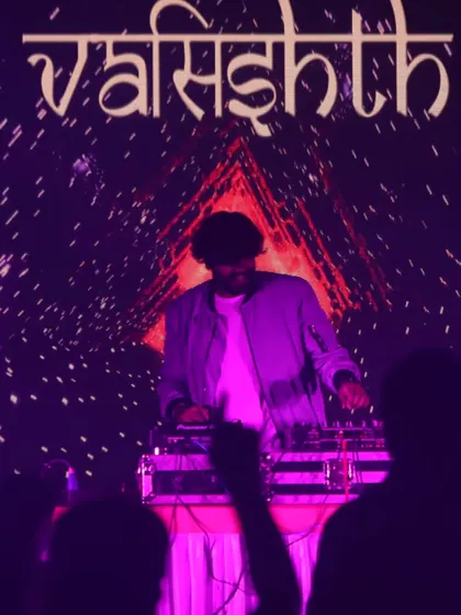 A silhouette of me against my custom visuals on the screen, creating a powerful and artistic stage presence.