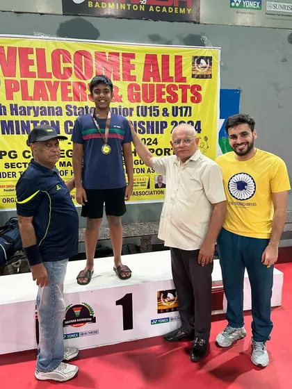 Presenting the medal to Shantvik Rao. Recognizing the hard work of my players is a key part of my coaching philosophy.