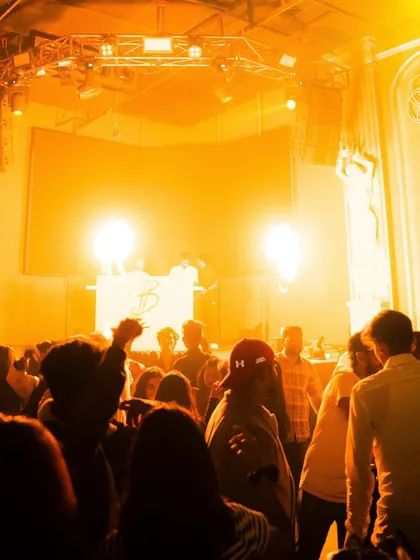 The dance floor is washed in golden light, creating an intense and immersive atmosphere. It's all about matching the lighting to the music's energy.