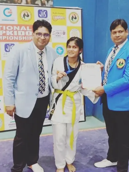 My student receiving her silver medal at the 7th National Hapkido Championship.