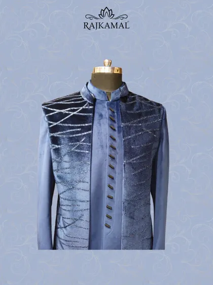 Another view of the midnight blue velvet jacket, showcasing its distinctive bandhgala collar and layered style.