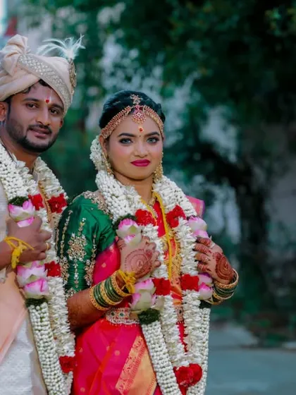 A classic portrait of a couple in their traditional wedding attire, ready for the ceremony.