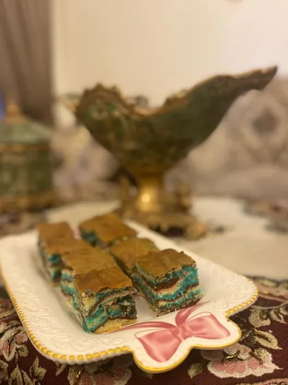 Slices of my super moist ribbon cake served on a pretty platter. It's a wonderful, fluffy tea cake.