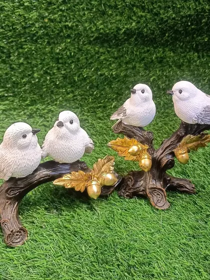 The two bird showpieces displayed together, creating a beautiful narrative of love and nature.