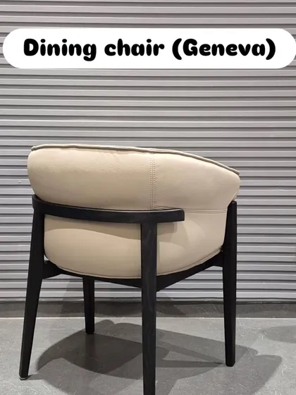 The back view of the 'Geneva' chair shows the elegant curve and the way the black frame provides a subtle contrast.