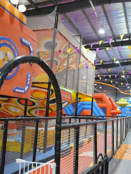 A glimpse of the expansive inflatable and soft play area, showing the variety of structures and challenges available.
