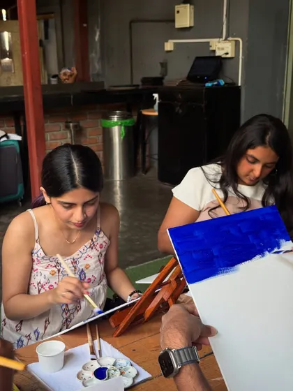 Two friends painting their own versions of Starry Night at the Bira 91 Taproom. It's all about good vibes and great company.
