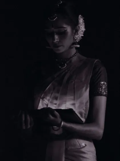 A quiet, contemplative moment captured in the wings, just before stepping onto the stage. The moments before showtime are filled with focus and anticipation.