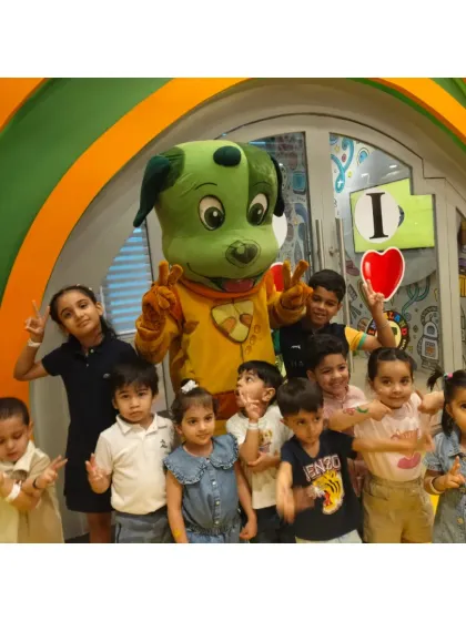 A big group of little friends gathers with Tinga Dojo for a fun photo. It's a happy, silly moment that captures the spirit of Tingaland.