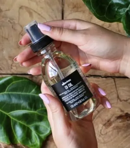 Davines OI Oil is a multi-benefit product that adds shine, softness, and detangles hair while fighting frizz. A true hero product for all hair types.