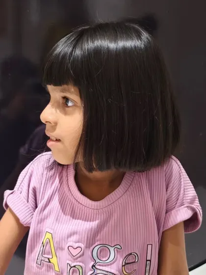 Another view of the adorable fringe haircut, perfect for summer.