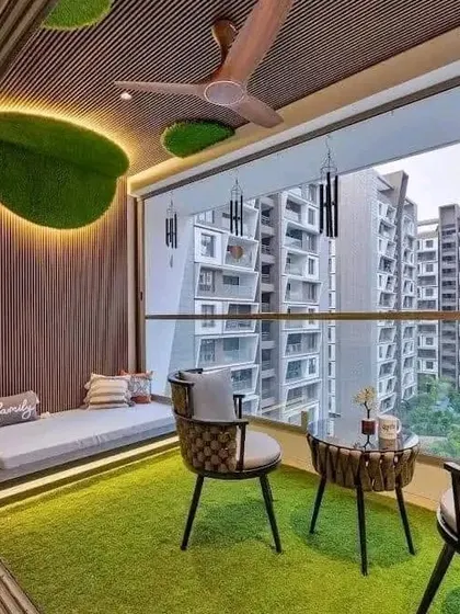 A closer look at the balcony design, complete with a wooden ceiling, artificial turf, and a comfortable daybed, extending the living space outdoors.