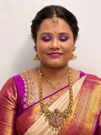 A close-up of the dramatic purple eye makeup. This is a great example of how to play with color for a festive occasion.