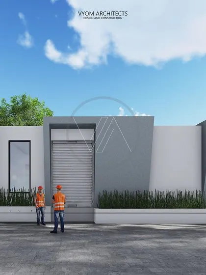 The facade of the factory's loading bay area. The design uses the same angular, concrete forms as the main building to maintain a consistent architectural language across the entire site.