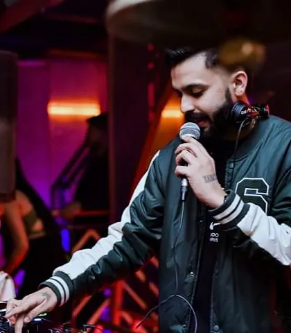 Hyping up the crowd on the mic. It's one of my favorite parts of the job, making sure everyone feels like they're part of the show.
