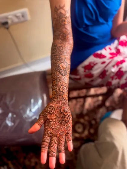 A single arm view of a floral bridal design. The pattern flows beautifully from the palm to the elbow, creating a cohesive and elegant look.
