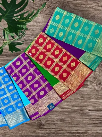 An assortment of our colorful half-and-half pure Mysore crepe silk sarees, showcasing the variety of combinations available.
